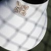 white widebrim cotton canvas visor with hawaiian quilt monstera pineapple logo.